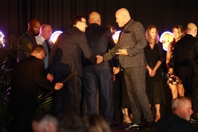 66 Winner Sub Mid Corp Center Andrew Don on stage.jpg