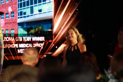 69 Winner Medical Laura walking to stage.jpg